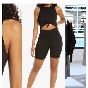 naked wardrobe front cutout romper in black size medium.